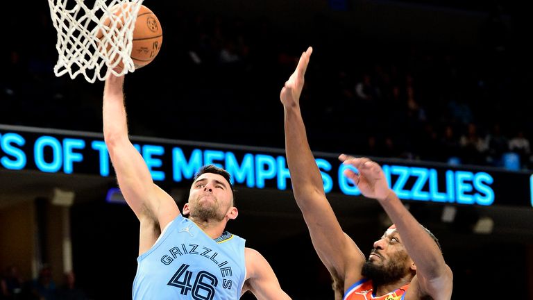 Memphis Grizzlies guard John Konchar jumps to shoot ahead of Oklahoma City Thunder guard Paul Watson