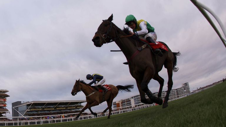 Fiddlerontheroof (far side) chases Ladbrokes Trophy winner Cloudy Glen at Newbury