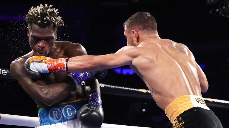 NEW YORK, NEW YORK - DECEMBER 11: Richard Commey (L) and Vasiliy Lomachenko (R) exchange punches during their fight for the WBO Intercontinental Lightweight Championship at Madison Square Garden on December 11, 2021 in New York City.  (Photo by Mikey Williams / Top Rank Inc via Getty Images)