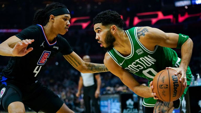 Los Angeles Clippers guard Brandon Boston Jr. (4) defends against Boston Celtics forward Jayson Tatum (0) during the second half of an NBA basketball game in Los Angeles, Wednesday, Dec. 8, 2021. (AP Photo/Ashley Landis)