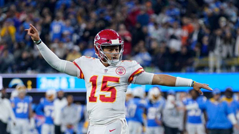 Kansas City Chiefs quarterback Patrick Mahomes reacts after throwing a touchdown pass to wide receiver Tyreek Hill during the second half of an NFL football game against the Los Angeles Chargers, Thursday, Dec. 16, 2021, in Inglewood, Calif. (AP Photo/Marcio Jose Sanchez)


