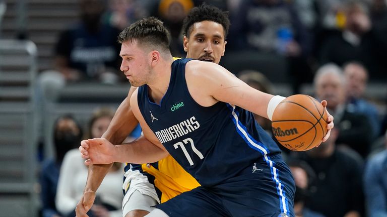 Dallas Mavericks' Luka Doncic drives past Indiana Pacers' Malcolm Brogdon