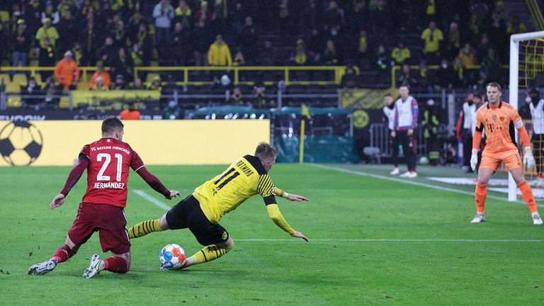 AP - Marco Reus goes down in the box against Bayern