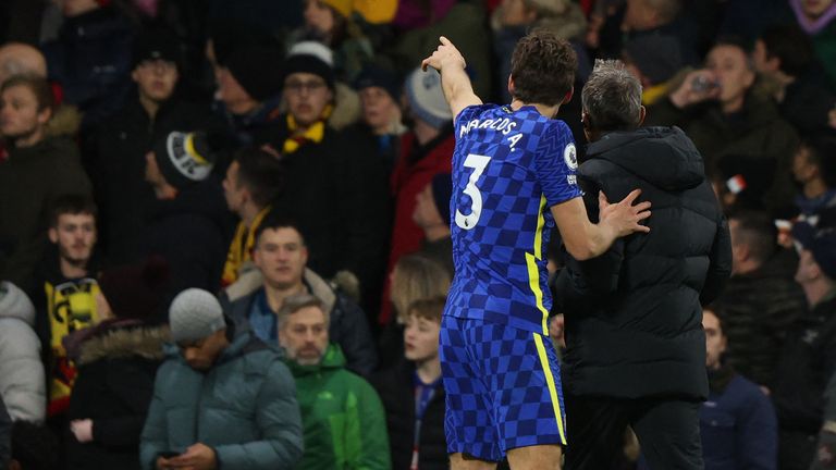 Marcos Alonso points a member of backroom staff toward the site of a medical emergency in the crowd