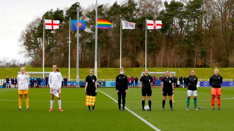 BURTON UPON TRENT, ENGLAND - FEBRUARY 23: Ellie Roebuck and Jill Scott of England, referee Lorraine Watson, Marissa Callaghan and Rebecca Flaherty of Northern Ireland line up before the England v Northern Ireland women's international friendly at St George's Park on February 23, 2021 in Burton upon Trent, England.  (Photo by Lynne Cameron - The FA / The FA via Getty Images)