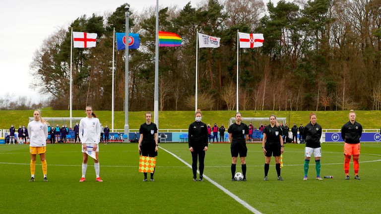 BURTON UPON TRENT, ENGLAND - FEBRUARY 23: Ellie Roebuck, and Jill Scott of England, Referee Lorraine Watson, Marissa Callaghan and Rebecca Flaherty of Northern Ireland line up prior to the Women's International Friendly match between England and Northern Ireland at St George's Park on February 23, 2021 in Burton upon Trent, England. (Photo by Lynne Cameron - The FA/The FA via Getty Images)