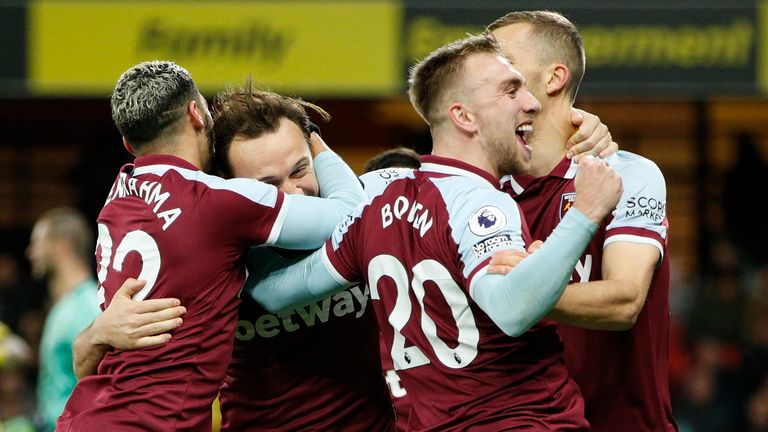 Mark Noble celebrates with teammates after scoring West Ham's third goal (AP)