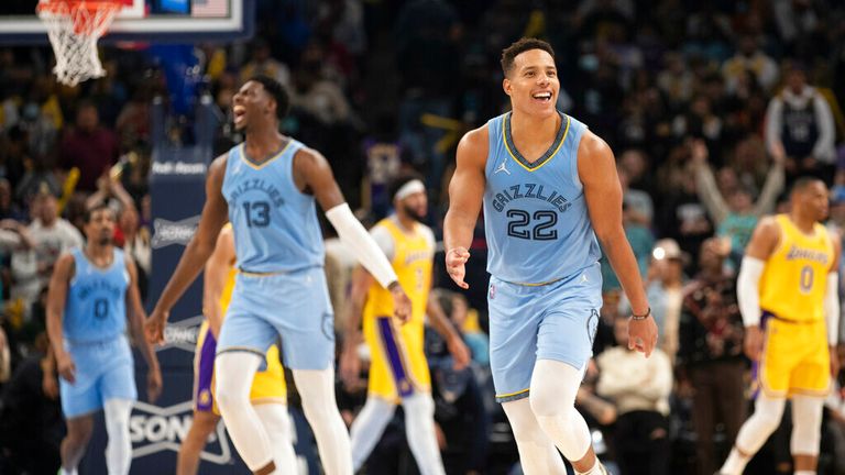 Memphis Grizzlies forward Jaren Jackson Jr. (13) and guard Desmond Bane (22) celebrate in the second half of an NBA basketball game Thursday, Dec. 9, 2021, in Memphis, Tenn. (AP Photo/Nikki Boertman)