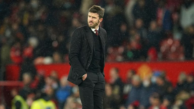 Manchester United's temporary coach Michael Carrick walks off the pitch at the end of the English Premier League soccer match between Manchester United and Arsenal at Old Trafford stadium in Manchester, England, Thursday, Dec. 2, 2021. United won the match 3-2. 