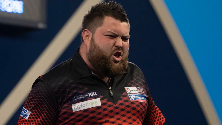 WILLIAM HILL WORLD DARTS CHAMPIONSHIP 2022.ALEXANDRA PALACE,.LONDON.PIC;LAWRENCE LUSTIG.ROUND2.MICHAEL SMITH V RON MEULENKAMP.MICHAEL SMITH IN ACTION