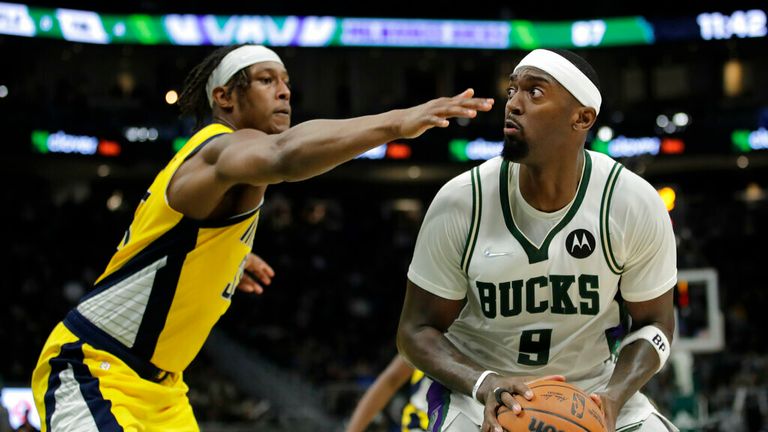 Milwaukee Bucks&#39; Bobby Portis (9) looks to shoot against Indiana Pacers&#39; Myles Turner during the second half of an NBA basketball game Wednesday, Dec. 15, 2021, in Milwaukee. (AP Photo/Aaron Gash)