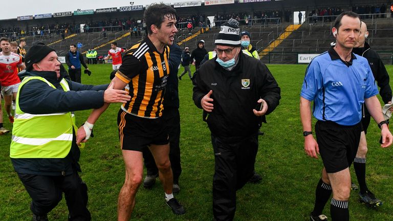 11 December 2021; Referee Jerome Henry is escorted off the field as Michael Daly of Mountbellew/Moylough attempts to confront him after the AIB Connacht GAA Football Senior Club Championship Semi-Final match between P..draig Pearses and Mountbellew/Moylough at Dr Hyde Park in Roscommon. Photo by E..in Noonan/Sportsfile