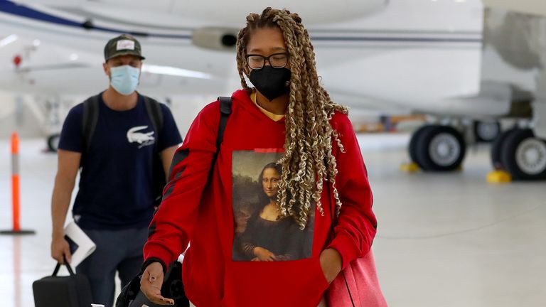 Naomi Osaka arrives on a chartered flight ahead of the 2022 tennis season leading into the 2022 Australian Open, at Melbourne Airport on December 28, 2021 in Melbourne, Australia. (Photo by Kelly Defina/Getty Images)