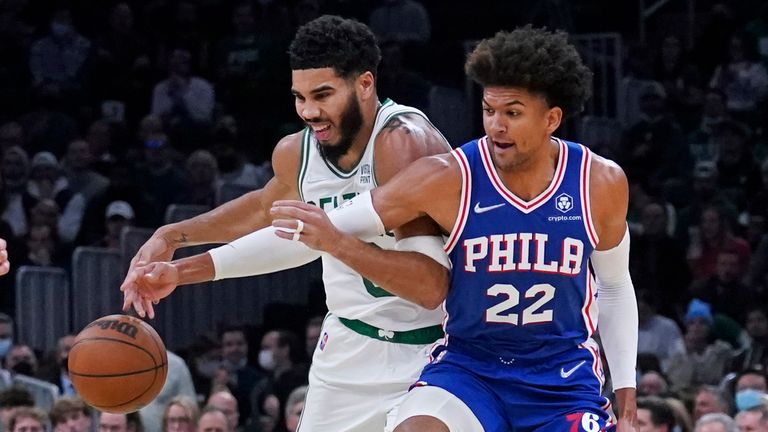 Philadelphia 76ers guard Matisse Thybulle (22) knocks the ball away from Boston Celtics forward Jayson Tatum (0) during the first half of an NBA basketball game, Wednesday, Dec. 1, 2021, in Boston. (AP Photo/Charles Krupa) 