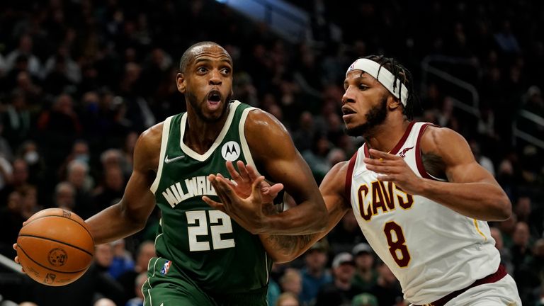 Milwaukee Bucks&#39; Khris Middleton is fouled by Cleveland Cavaliers&#39; Lamar Stevens during the second half of an NBA basketball game Monday, Dec. 6, 2021, in Milwaukee. The Bucks won 112-104. (AP Photo/Morry Gash)


