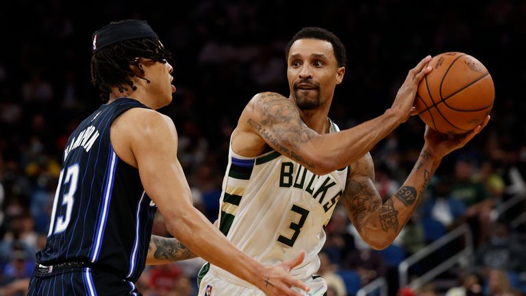 Milwaukee Bucks guard George Hill (3) tries to pass the ball under pressure from Orlando Magic guard R.J. Hampton (13) during the second half of an NBA basketball game Tuesday, Dec. 28, 2021, in Orlando, Fla. (AP Photo/Scott Audette)


