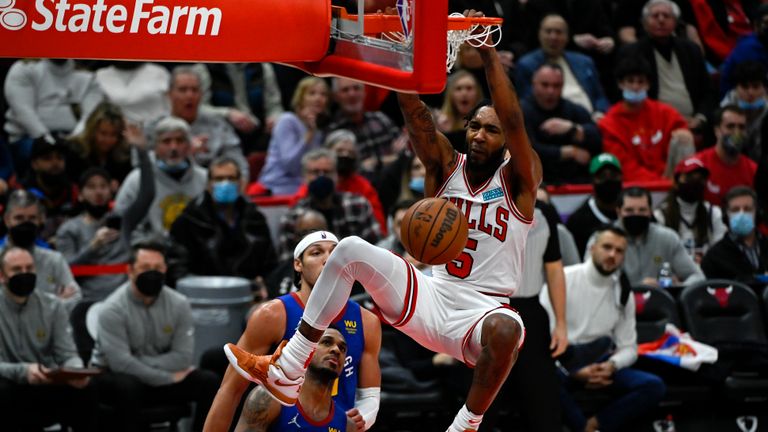 Chicago Bulls forward Derrick Jones Jr. dunks against the Denver Nuggets during the second half of an NBA basketball game Monday, Dec. 6, 2021, in Chicago. (AP Photo/Matt Marton)


