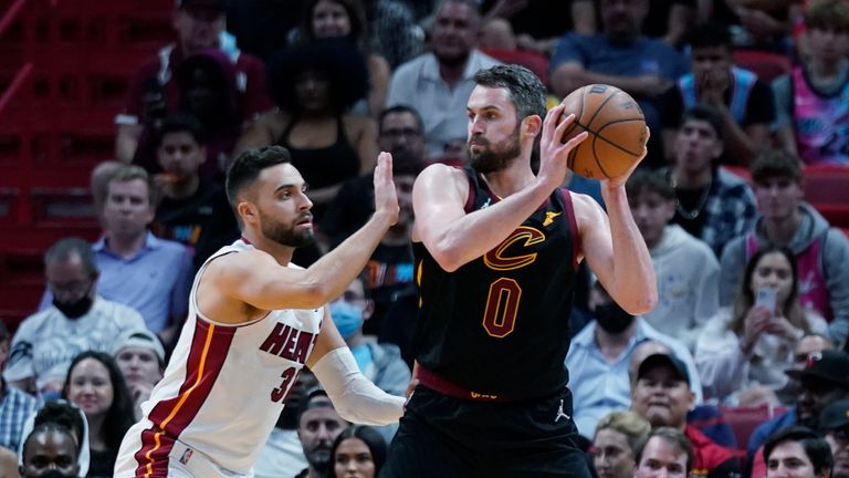 Cleveland Cavaliers forward Kevin Love (0) looks for an open teammate past Miami Heat guard Max Strus (31) during the second half of an NBA basketball game, Wednesday, Dec. 1, 2021, in Miami. (AP Photo/Wilfredo Lee)


