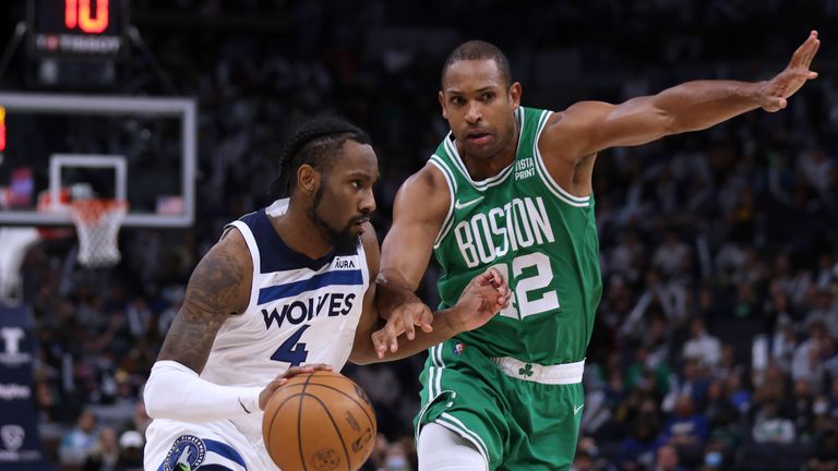Minnesota Timberwolves guard Jaylen Nowell (4) drives on Boston Celtics center Al Horford (42) during the second half of an NBA basketball game on Monday, December 27, 2021 in Minneapolis.  Minnesota won 108-103.  (AP Photo / Stacy Bengs)