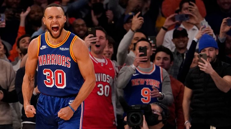 Golden State Warriors guard Stephen Curry reacts after scoring a 3-point basket during the first half of an NBA basketball game against the New York Knicks, Tuesday, Dec. 14, 2021, at Madison Square Garden in New York. Curry hit his 2,974th 3-pointer Tuesday night in the first quarter, breaking the record set by Ray Allen.