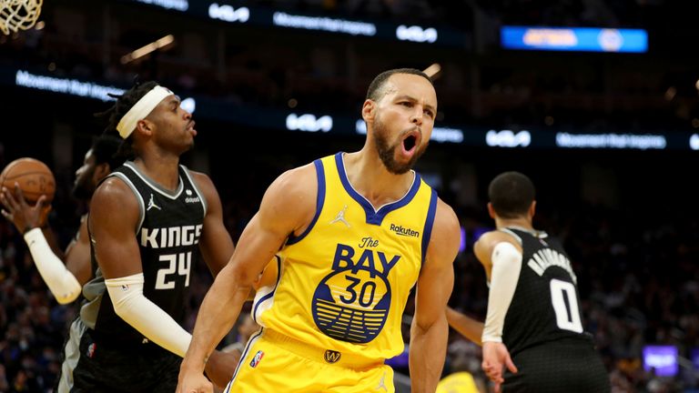 Golden State Warriors guard Stephen Curry screams after scoring against the Sacramento Kings during the second half of an NBA basketball game in San Francisco on Monday, December 20, 2021.
