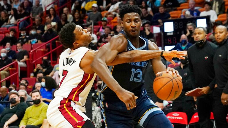 Memphis Grizzlies forward Jaren Jackson Jr. (13) drives to the basket as Miami Heat guard Kyle Lowry (7) defends during the first half of an NBA basketball game, Monday, Dec. 6, 2021, in Miami. (AP Photo/Marta Lavandier)


