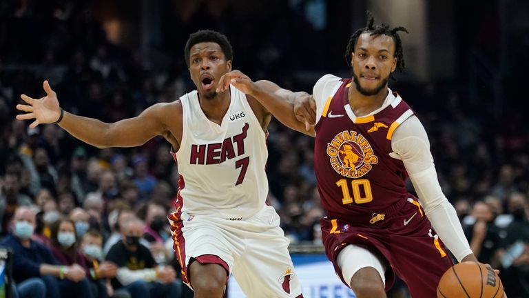 Cleveland Cavaliers&#39; Darius Garland (10) drives against Miami Heat&#39;s Kyle Lowry (7) in the first half of an NBA basketball game, Monday, Dec. 13, 2021, in Cleveland. (AP Photo/Tony Dejak)


