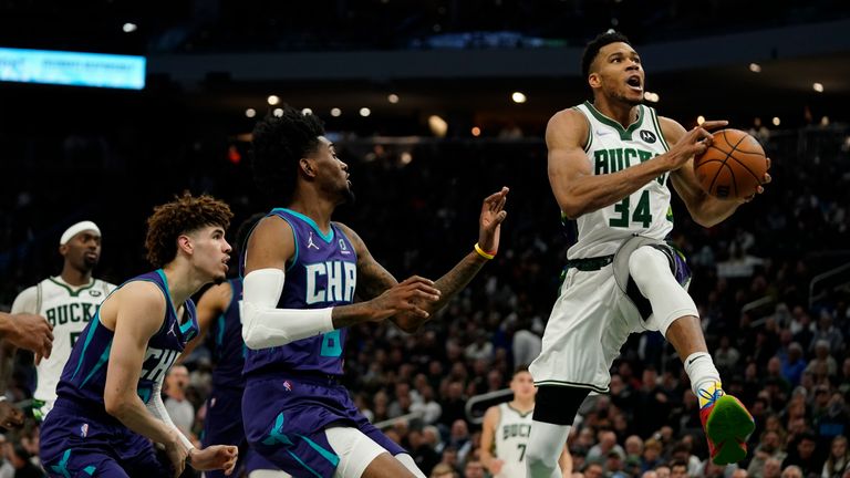 Milwaukee Bucks&#39; Giannis Antetokounmpo shoots during the second half of an NBA basketball game against the Charlotte Hornets Wednesday, Dec. 1, 2021, in Milwaukee. The Bucks won 127-125. (AP Photo/Morry Gash)


