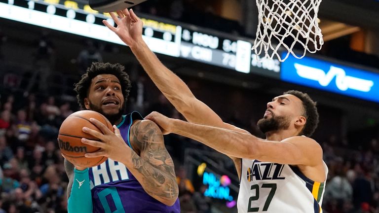 Utah Jazz center Rudy Gobert (27) defends against Charlotte Hornets forward Miles Bridges (0) in the first half during an NBA basketball game Monday, Dec. 20, 2021, in Salt Lake City.