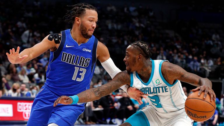Dallas Mavericks guard Jalen Brunson (13) guards against Charlotte Hornets guard Terry Rozier (3) in the second half of an NBA basketball game Monday, Dec. 13, 2021, in Dallas. (AP Photo/Richard W. Rodriguez)


