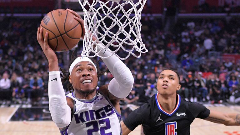 Sacramento Kings center Richaun Holmes, left, shoots as Los Angeles Clippers guard Brandon Boston Jr. defends during the second half of an NBA basketball game Wednesday, Dec. 1, 2021, in Los Angeles. (AP Photo/Mark J. Terrill)


