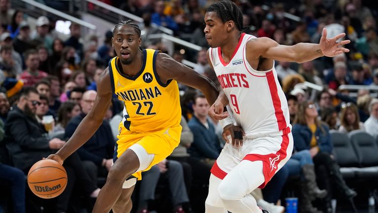 Indiana Pacers&#39; Caris LeVert (22) goes to the basket against Houston Rockets&#39; Josh Christopher (9) during the second half of an NBA basketball game, Thursday, Dec. 23, 2021, in Indianapolis. 