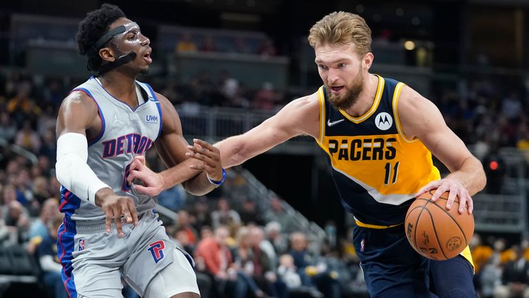 Indiana Pacers&#39; Domantas Sabonis (11) goes to the basket against Detroit Pistons&#39; Hamidou Diallo (6) during the second half of an NBA basketball game, Thursday, Dec. 16, 2021, in Indianapolis.