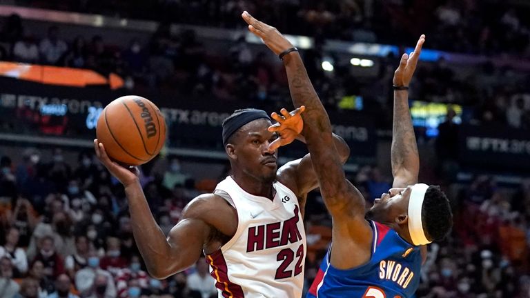 Miami Heat forward Jimmy Butler (22) looks to pass as Washington Wizards&#39; Craig Sword (32) defends during the second half of an NBA basketball game, Tuesday, Dec. 28, 2021, in Miami. The Heat won 119-112. (AP Photo/Lynne Sladky)


