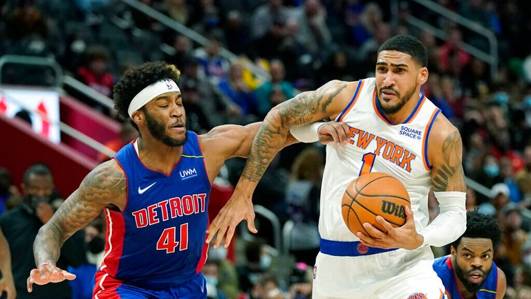 New York Knicks guard Tyler Hall (1) drives as Detroit Pistons forward Saddiq Bey (41) defends during the second half of an NBA basketball game, Wednesday, Dec. 29, 2021, in Detroit. (AP Photo/Carlos Osorio)