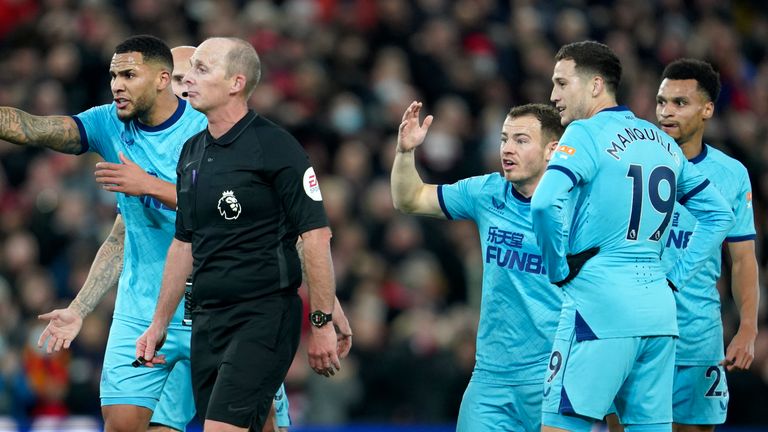 Newcastle players react after Liverpool's equaliser
