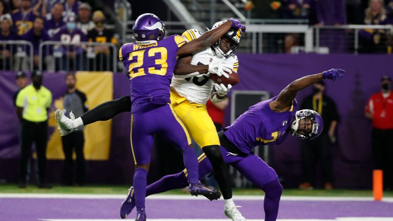 Pittsburgh Steelers wide receiver James Washington (13) catches a 30-yard touchdown pass between Minnesota Vikings free safety Xavier Woods (23) and cornerback Patrick Peterson (7) during the second half of an NFL football game, Thursday, Dec. 9, 2021, in Minneapolis. (AP Photo/Bruce Kluckhohn)


