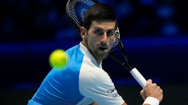 Serbia&#39;s Novak Djokovic returns the ball to Britain...s Cameron Norrie during their ATP World Tour Finals singles tennis match, at the Pala Alpitour in Turin, Friday, Nov. 19, 2021. (AP Photo/Luca Bruno)