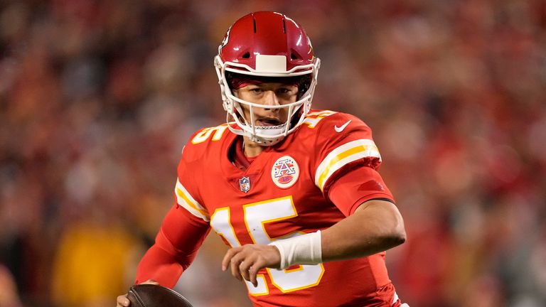 Download Sporting His Signature Yellow Jersey, Kansas City Chiefs  Quarterback Patrick Mahomes Scores a Touchdown Wallpaper