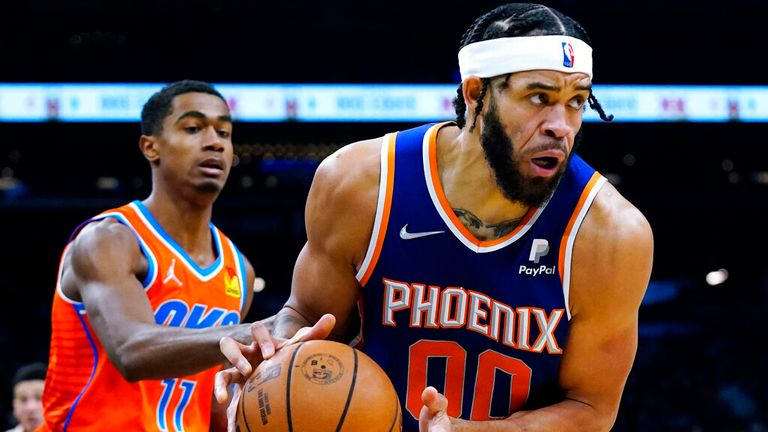 Phoenix Suns center JaVale McGee (00) grabs a rebound in front of Oklahoma City Thunder guard Theo Maledon (11) during the second half of an NBA basketball game Wednesday, Dec. 29, 2021, in Phoenix. The Suns won 115-97. (AP Photo/Ross D. Franklin)