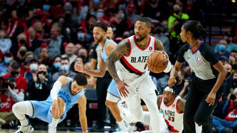 Portland Trail Blazers guard Damian Lillard brings the ball up court against the Memphis Grizzlies during the second half of an NBA basketball game in Portland, Ore., Wednesday, Dec. 15, 2021. (AP Photo/Craig Mitchelldyer)