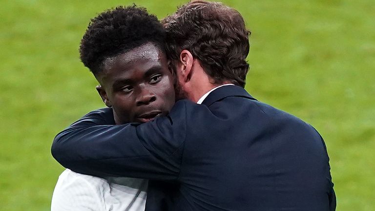 Gareth Southgate hugs Bukayo Saka after England's Euro 2020 final defeat