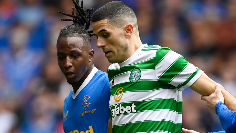 GLASGOW, SCOTLAND - AUGUST 29: Celtic's Tom Rogic (centre) holds off Joe Aribo (left) and Steve Davis during a cinch Premiership match between Rangers and Celtic at Ibrox, on August 29, 2021, in Glasgow, Scotland (Photo by Rob Casey / SNS Group)