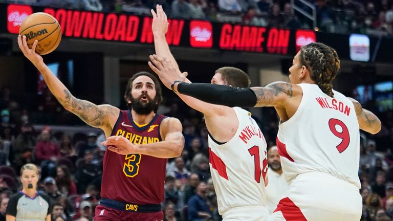 Cleveland Cavaliers&#39; Ricky Rubio drives against Toronto Raptors&#39; Svi Mykhailiuk and D.J. Wilson
