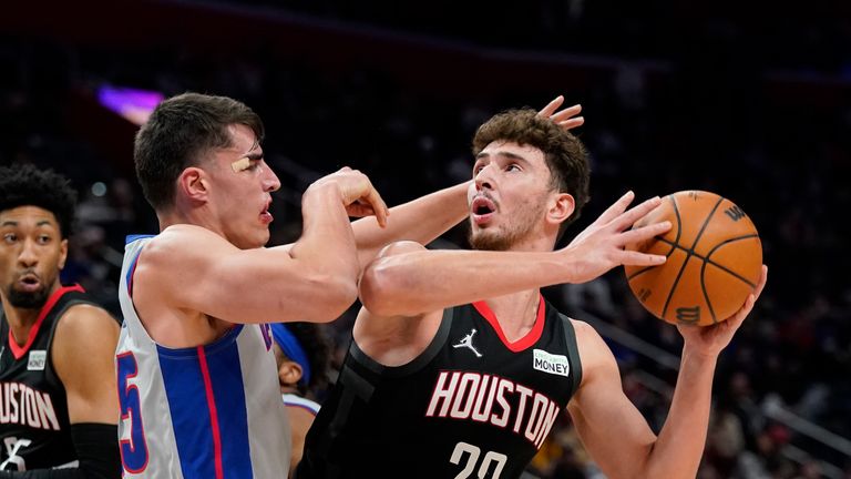 Houston Rockets center Alperen Sengun (28) is defended by Detroit Pistons center Luka Garza during the second half of an NBA basketball game, Saturday, Dec. 18, 2021, in Detroit. (AP Photo/Carlos Osorio)



