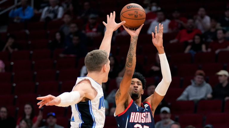 Houston Rockets center Christian Wood (35) shoots as Orlando Magic forward Franz Wagner defends during the first half of an NBA basketball game Friday, Dec. 3, 2021, in Houston. (AP Photo/Eric Christian Smith)


