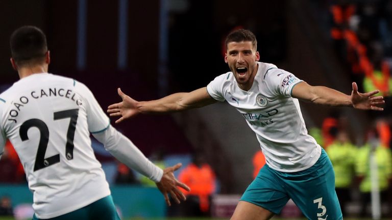 Manchester City's Ruben Dias celebrates scoring the opening goal at Villa Park