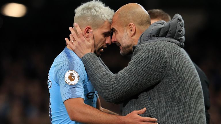 Sergio Aguero of Manchester City is embraced by Josep Guardiola, Manager of Manchester City as he is substituted during the Premier League match between Manchester City and Manchester United at Etihad Stadium on November 11, 2018