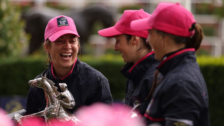 Hayley Turner lifts the Shergar Cup trophy after victory for the Ladies team at Ascot