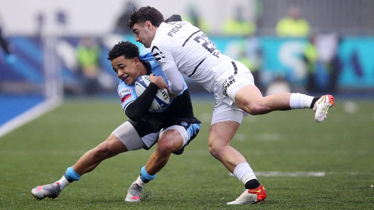 Cardiff's Theo Cabango is tackled by Toulouse's Baptiste Germain during the Heineken Champions Cup match at Cardiff Arms Park, Cardiff. Picture date: Saturday December 11, 2021.